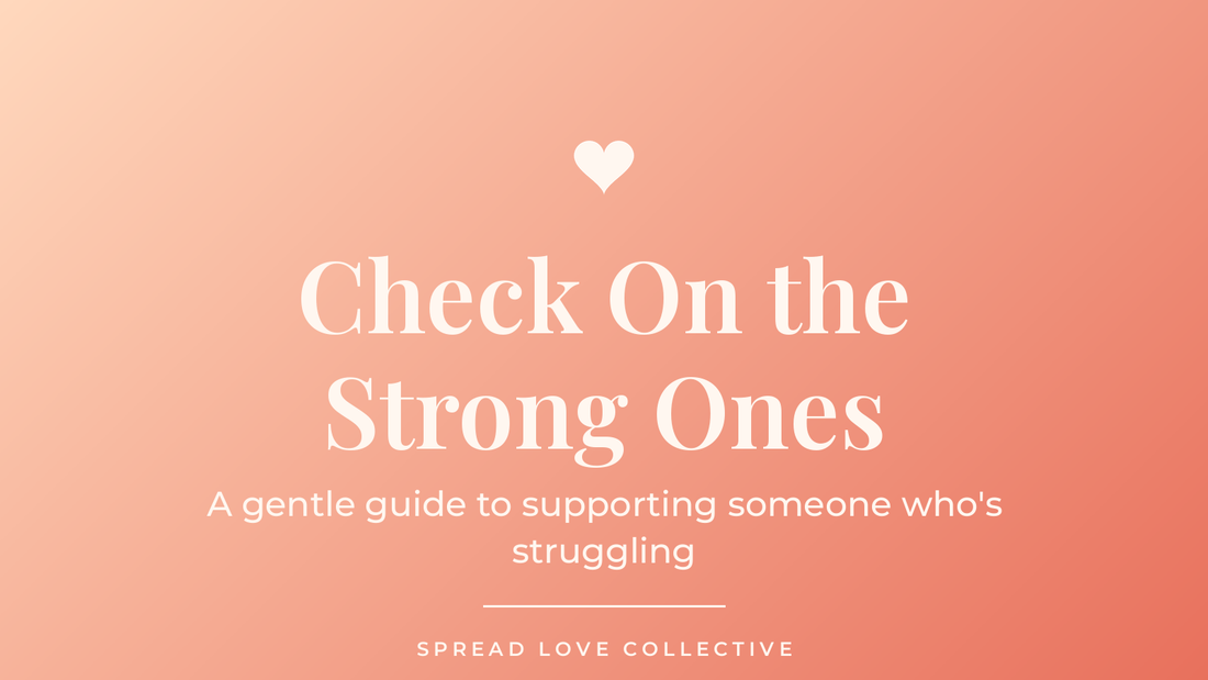 Warm peach-to-coral graphic reading "Check On the Strong Ones" with a heart, from Spread Love Collective's post on supporting someone who's struggling.